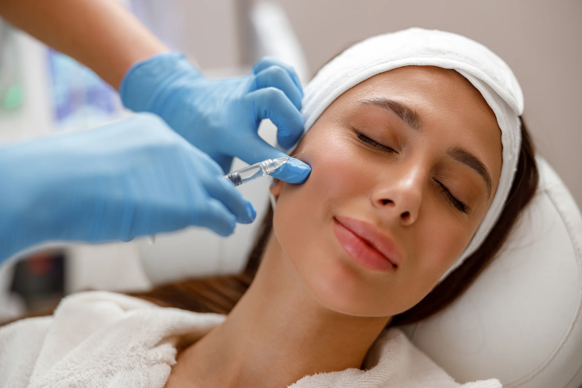 A woman getting cheek filler||