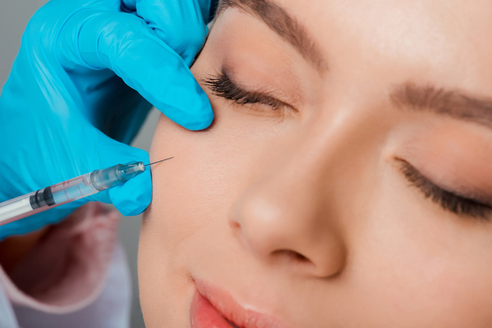a woman getting cheek fillers||