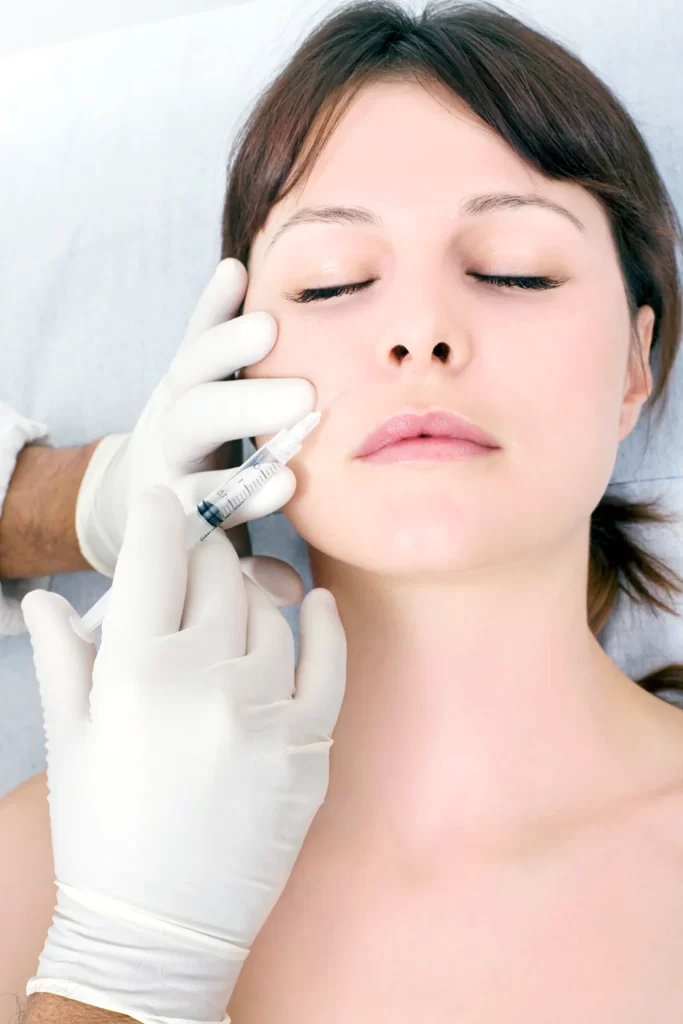 a woman having cheek fillers