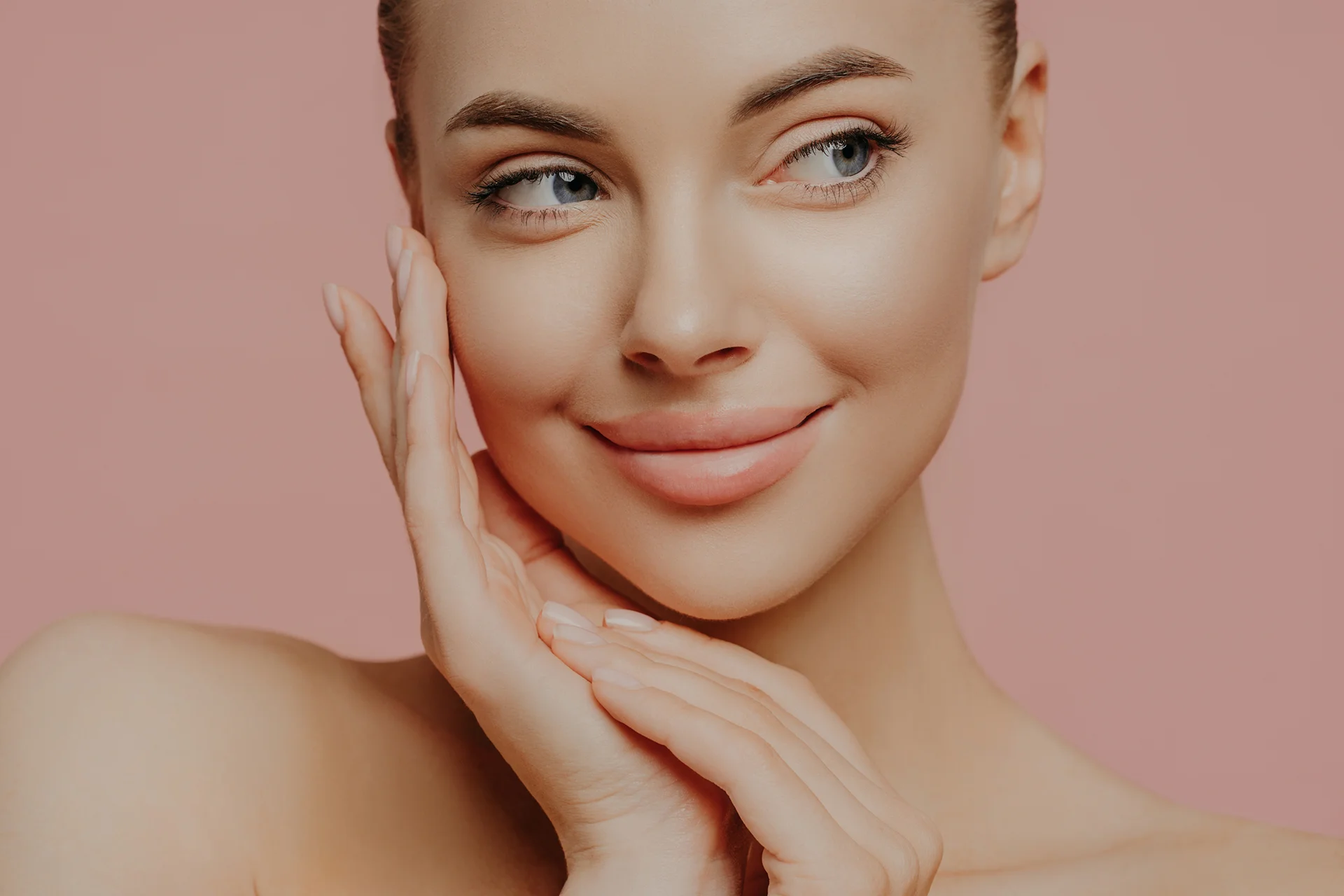 a portrait of a beautiful, smiling woman|a woman had cheek filller injection|